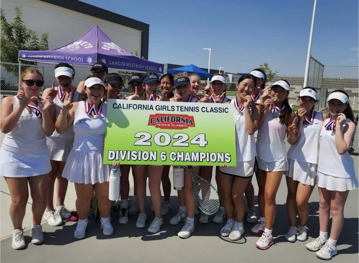 The Tennis team celebrating their win at clovis